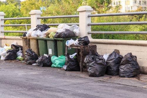 Waste collection trucks operating in Dalston streets